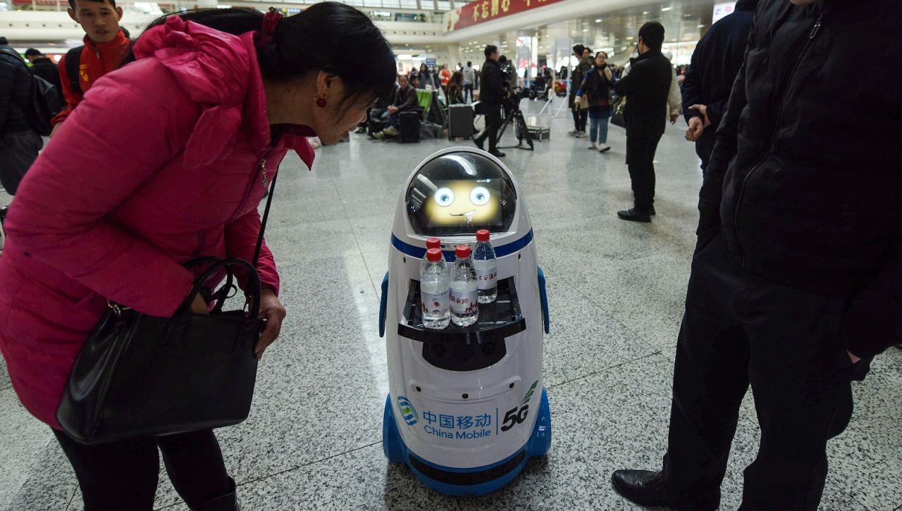 <strong>Robotic thirst quenchers:</strong> A 5G service robot serves free bottles of water to travelers at East Railway Station in Hangzhou in China's eastern Zhejiang province on the first day of the Spring Festival travel rush.  