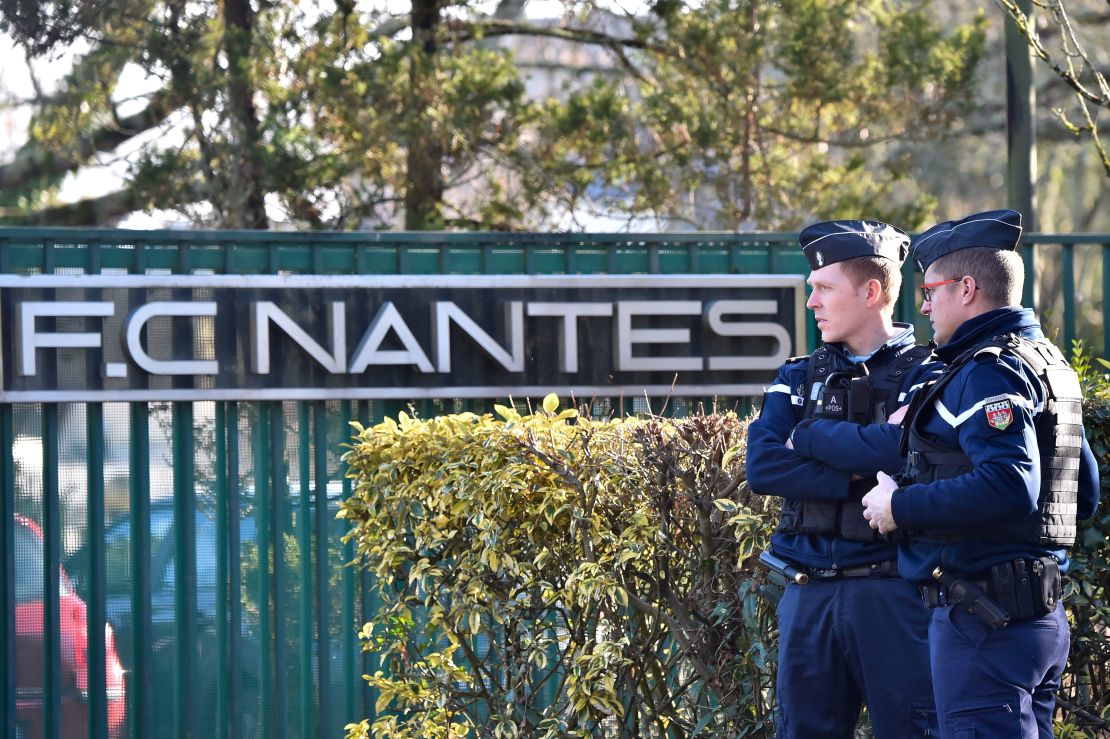 French police gather Tuesday at the entrance of the FC Nantes training center in La Chapelle-sur-Erdre.