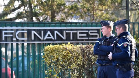 French police gather Tuesday at the entrance of the FC Nantes training center in La Chapelle-sur-Erdre.