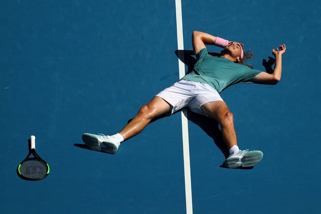 Stefanos Tsitsipas fell to the court in joy after winning his quarterfinal at the Australian Open. 