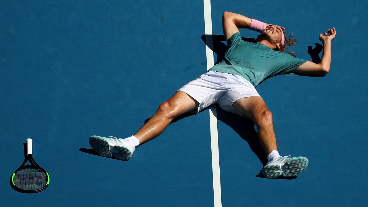 Stefanos Tsitsipas fell to the court in joy after winning his quarterfinal at the Australian Open. 