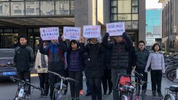 A group of students hold up signs as they protest against the change in a student-run Marxist group's leadership at Peking University in Beijing on December 28, 2018. - A dozen students from a top Chinese university staged the protest on December 28 after the school removed the president of an on-campus Marxist group amid an ongoing crackdown on student activists this year. (Photo by EVA XIAO / AFP)        (Photo credit should read EVA XIAO/AFP/Getty Images)
