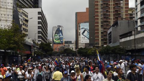 Opposition supporters take part Wednesday in a Caracas march on the anniversary of a 1958 uprising.