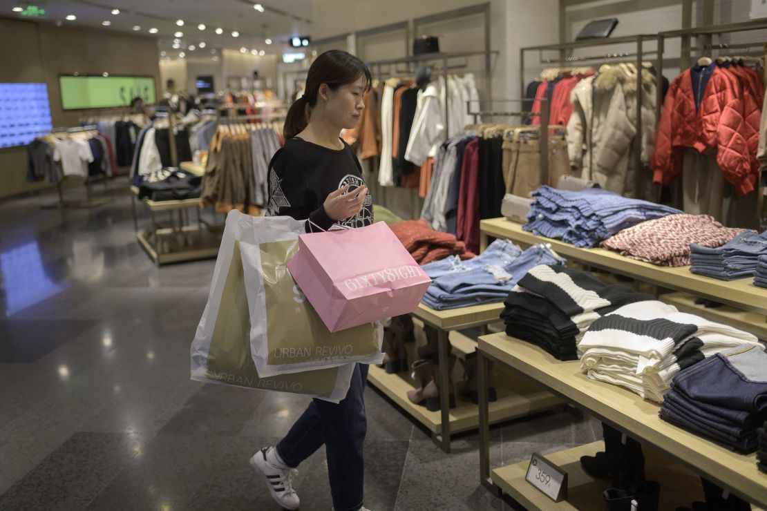 A customer shopping for clothing at a mall in Beijing. Growth in retail sales is slowing in China, but it's still outpacing the United States.