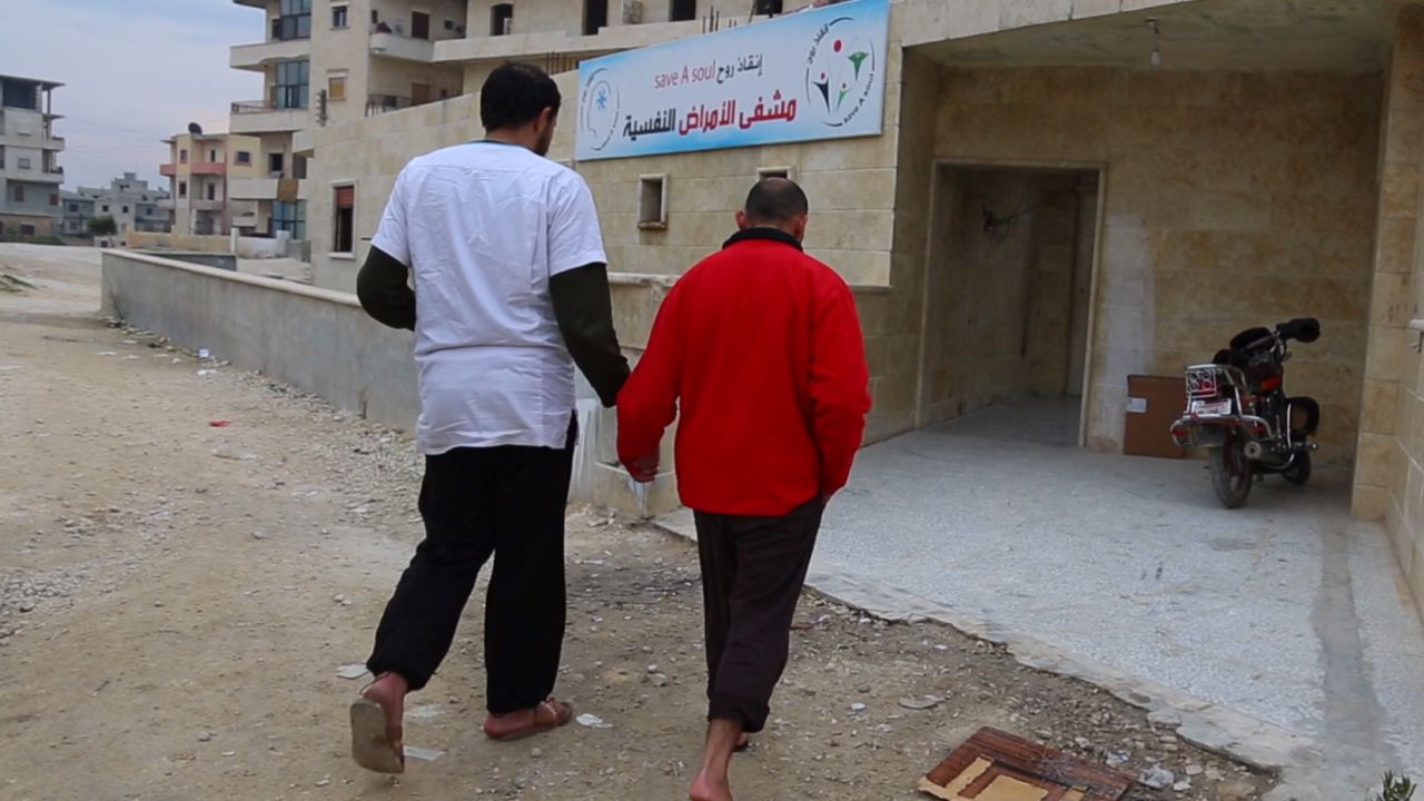 An unnamed patient enters rebel-held Idlib's only rehabilitation center for drug addicts.