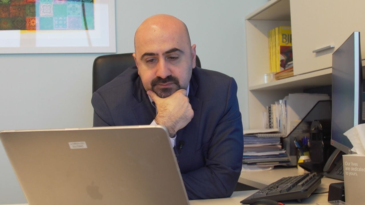 Dr. Joseph el-Khoury watches Idlib's drug users' testimonies.
