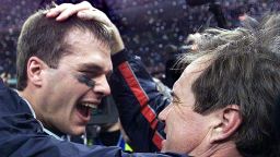 NEW ORLEANS, UNITED STATES:  New England Patriots' quarterback Tom Brady celebrates with head coach Bill Belichick (R) after their win over the St. Louis Rams 03 February, 2002 in Super Bowl XXXVI in New Orleans, Louisiana. The Patriots defeated the Rams 20-17 for the NFL championship. AFP PHOTO/Jeff HAYNES (Photo credit should read JEFF HAYNES/AFP/Getty Images)