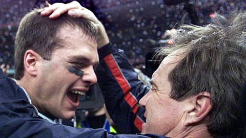 New England Patriots quarterback Tom Brady celebrates with head coach Bill Belichick after their win over the St. Louis Rams in Super Bowl XXXVI in New Orleans on February 3, 2002. 