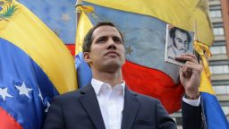Venezuela's National Assembly head Juan Guaido declares himself the country's "acting president" during a mass opposition rally against leader Nicolas Maduro, on the anniversary of a 1958 uprising that overthrew military dictatorship in Caracas on January 23, 2019. - Moments earlier, the loyalist-dominated Supreme Court ordered a criminal investigation of the opposition-controlled legislature. "I swear to formally assume the national executive powers as acting president of Venezuela to end the usurpation, (install) a transitional government and hold free elections," said Guaido as thousands of supporters cheered. (Photo by Federico PARRA / AFP)        (Photo credit should read FEDERICO PARRA/AFP/Getty Images)
