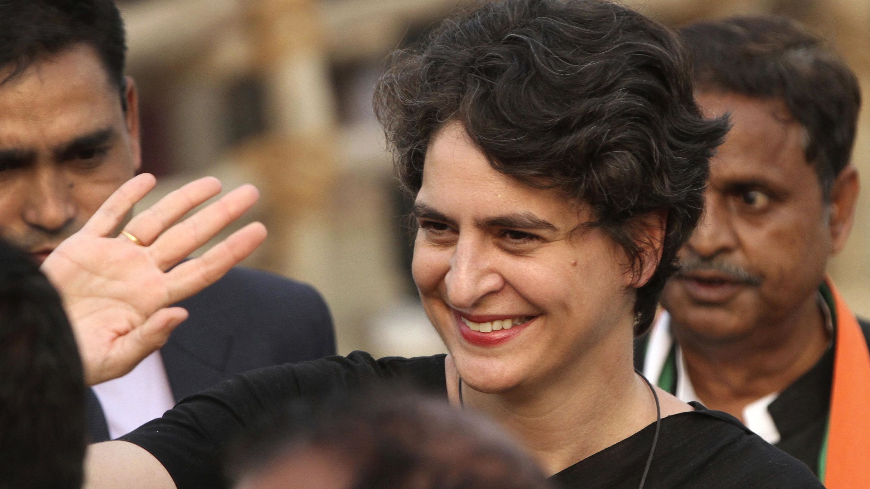 Priyanka Gandhi Vadra waves to Congress Party supporters during an election campaign rally in the northern Indian state of Uttar Pradesh on February 16, 2017.