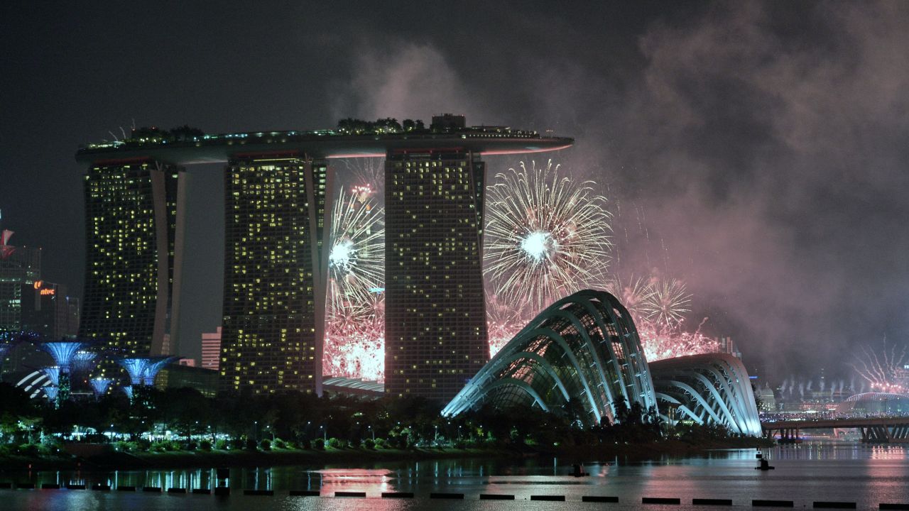 Fireworks burst over the skyline during a preview for the 50th Singapore National Day celebration on August 1, 2015.