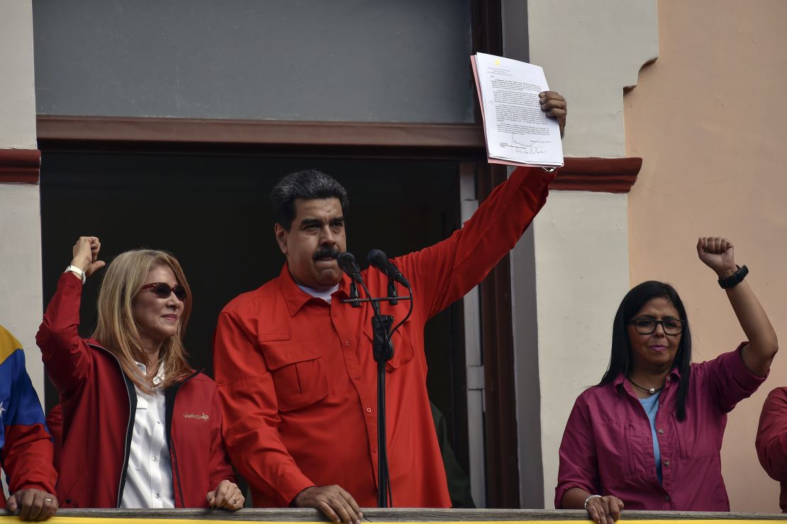 Venezuelan President Nicolas Maduro holds up a document with which he broke off US diplomatic ties.