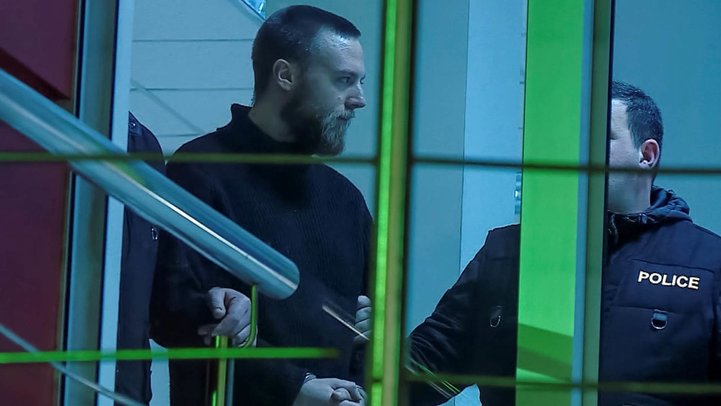 Jack Shepherd is seen being escorted inside a police station in Tbilisi, Georgia, on January 23, 2019.