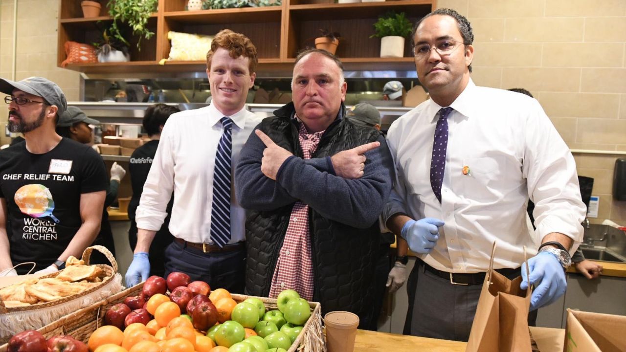 US Reps. Joe Kennedy III, left, and Will Hurd, right, work with chef José Andrés to feed federal workers on Wednesday, January 23, 2019, in Washington.