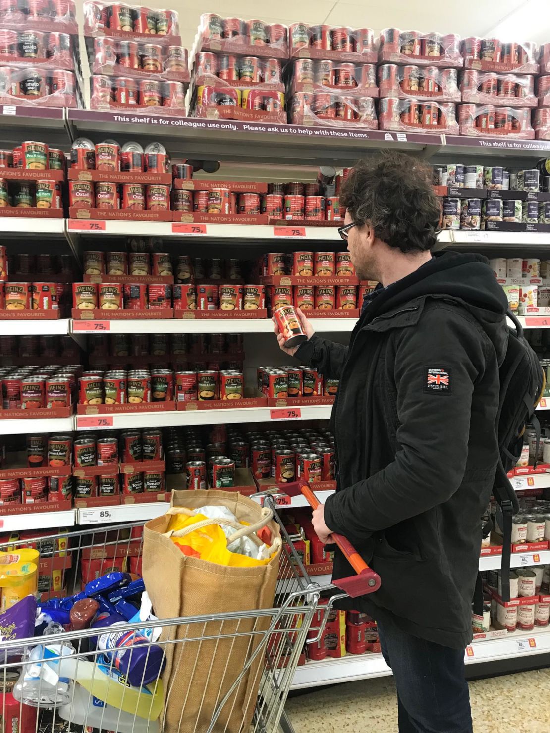 Graham Hughes stocks up on canned foods.