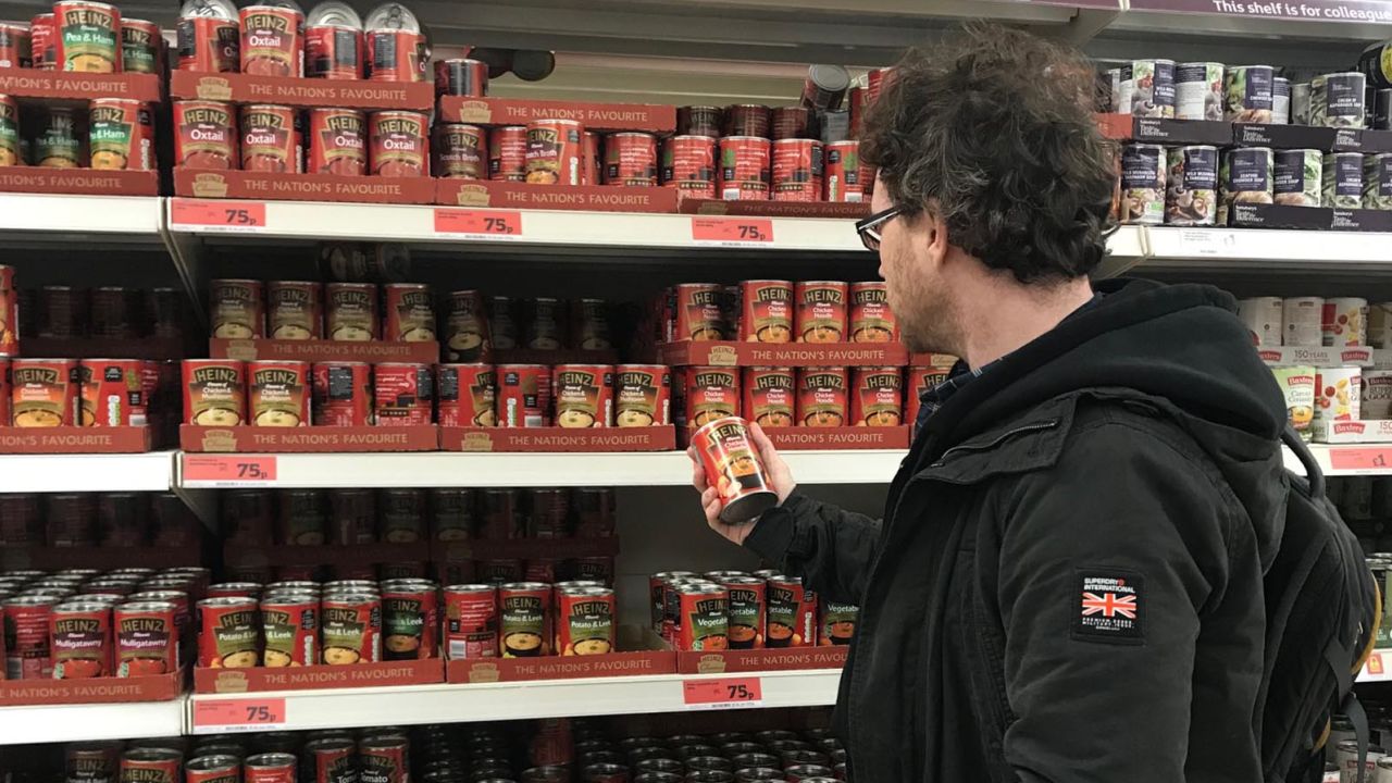 Graham Hughes stocks up on canned foods.