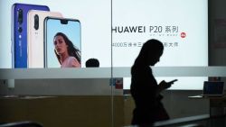 A Huawei poster is displayed in a Huawei store in Beijing on August 7, 2018. - Despite being essentially barred from the critical US market, Huawei surpassed Apple to become the world's number two smartphone maker in the second quarter of this year and has market leader Samsung in its sights. Huawei has achieved this in part by refocusing away from the futile fight for US access and toward gobbling up market share in developing nations with its moderately priced but increasingly sophisticated phones, analysts said. (Photo by WANG ZHAO / AFP) / TO GO WITH China-telecommunication-Huawei-mobile-Samsung-Apple,FOCUS by Dan Martin        (Photo credit should read WANG ZHAO/AFP/Getty Images)