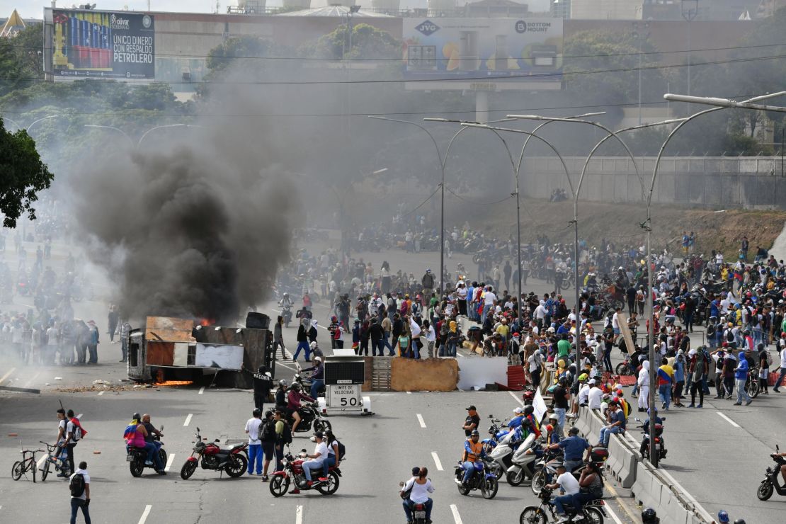 Venezuelan demonstrators set up a barricade during a protest against the government of President Maduro on January 23.