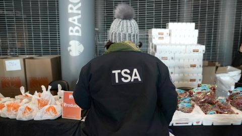 A furloughed TSA employee considers the options at the Barclays Center as the Food Bank For NYC holds food distribution for federal workers.