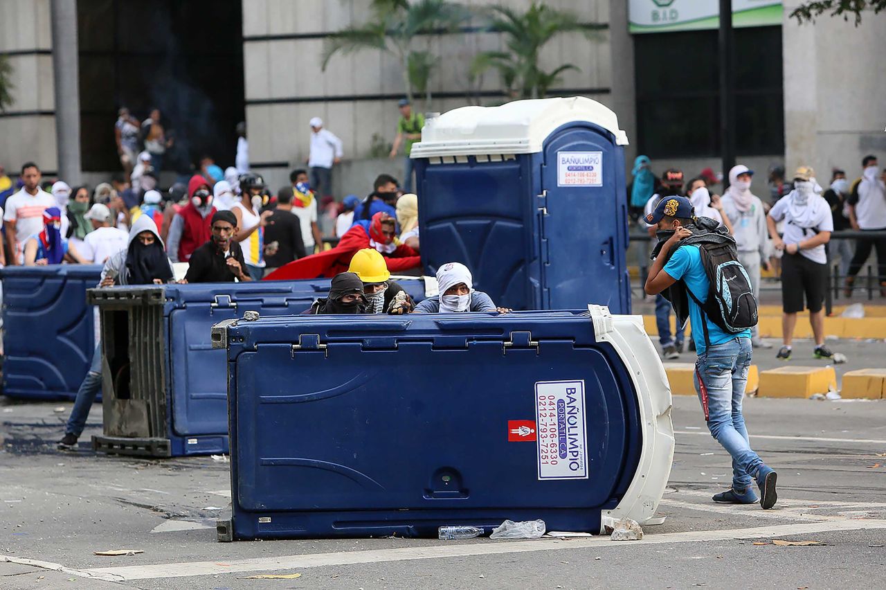 Demonstrators in Caracas protest Maduro's government.