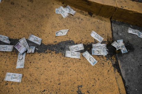 Venezuelan banknotes were thrown on the ground during the Maduro protests on January 23.