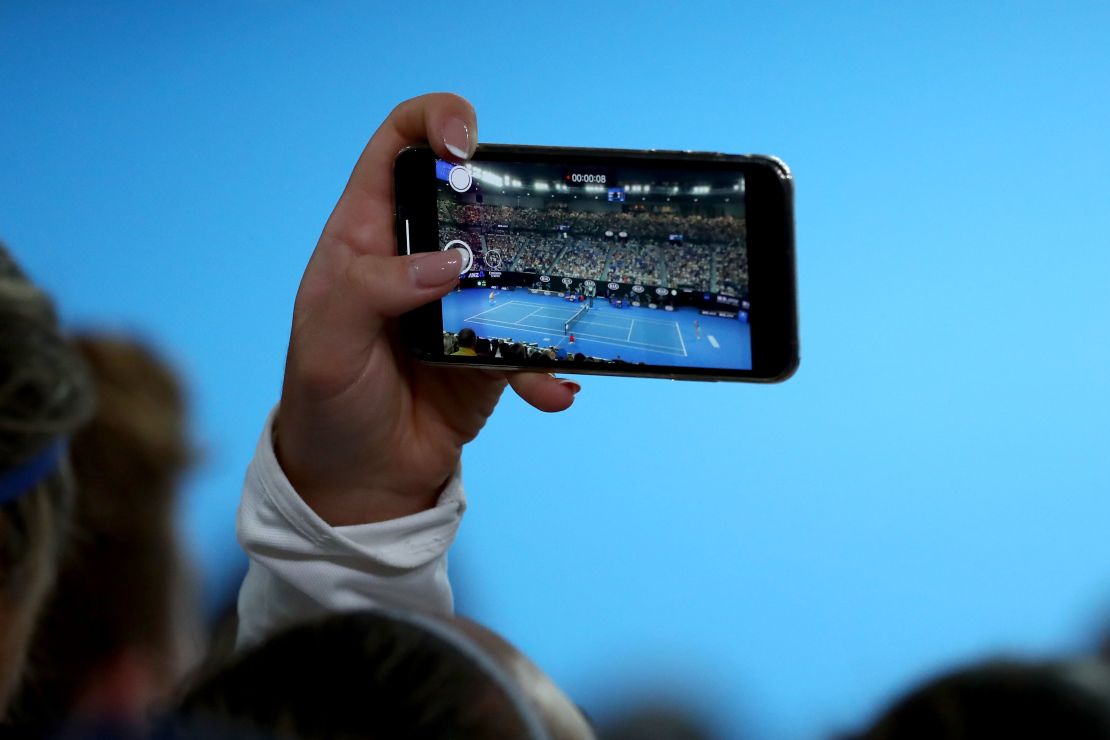 A fan takes in the Naomi Osaka-Karolina Pliskova match at the Australian Open. 