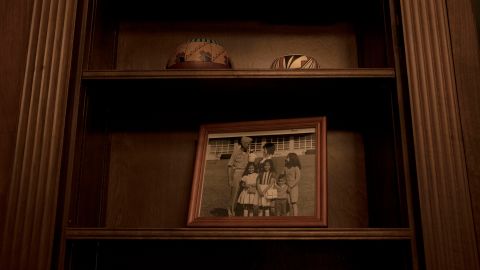 Pictures of family members sit on the shelf in Haaland's office.