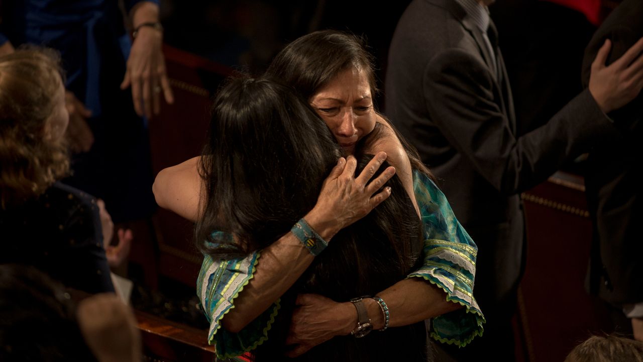 Rep. Haaland embraces fellow Native American Rep. Sharice Davids of Kansas after the swearing in of the 116th Congress.