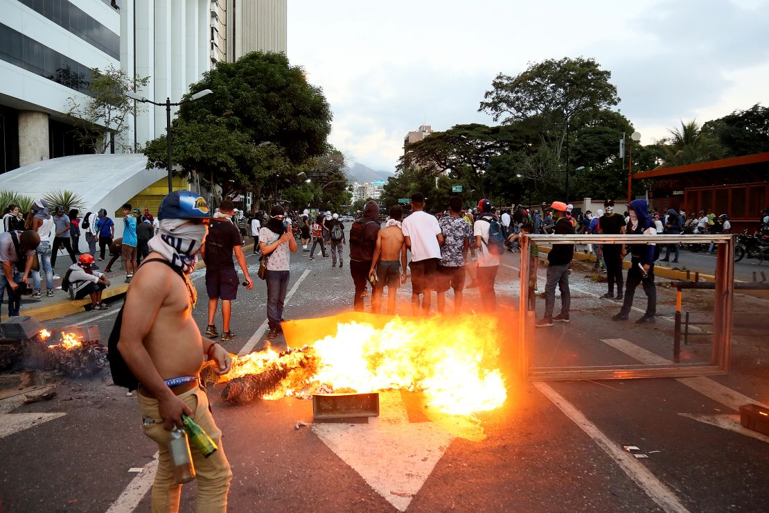 A fire burns during a protest Wednesday in Caracas against the government of Nicolas Maduro.