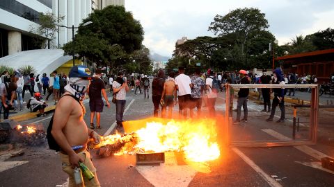 A fire burns during a protest Wednesday in Caracas against the government of Nicolas Maduro.