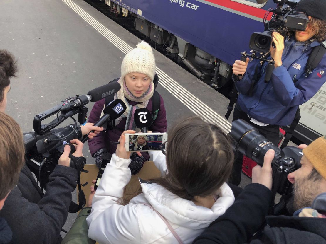 Swedish climate activist Greta Thunberg talks to journalists during her trip to Davos.