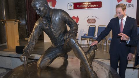 The UK's Prince William unveils a statute in honour of Matthew Flinders, the first cartographer to circumnavigate Australia and identify it as a continent at Australia House in 2014.