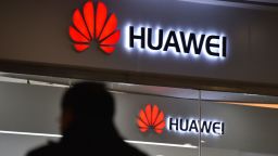 A man walks past a Huawei store in Beijing on December 10, 2018. - China on December 10 protested Canada's "inhumane" treatment of an executive of telecom giant Huawei who is being held on a US extradition bid, following reports she was not getting sufficient medical care. (Photo by GREG BAKER / AFP)        (Photo credit should read GREG BAKER/AFP/Getty Images)