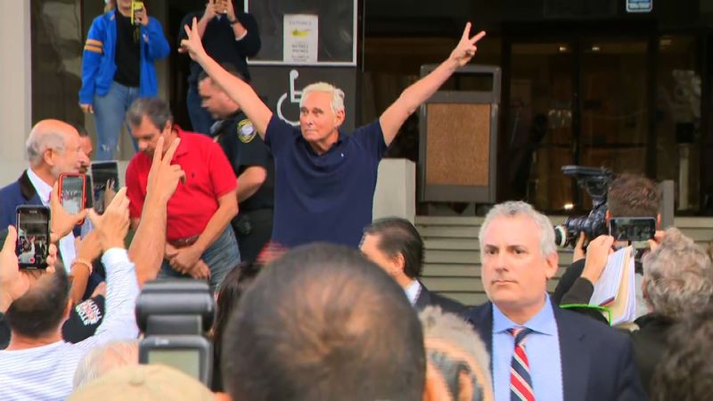 Roger Stone exits court with Nixonian salute