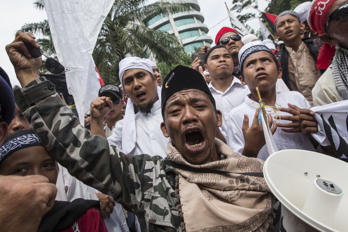 Members of various hardline Muslim groups celebrate after Jakarta's Governor was convicted of committing blasphemy on May 9, 2017 in Jakarta, Indonesia.