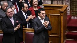 Greece's Prime Minister Alexis Tsipras celebrates after a voting session on the Prespa Agreement, an agreement aimed at ending a 27-year bilateral row by changing the name of Macedonia to the Republic of North Macedonia, at the Greek Parliament, in Athens, on January 25, 2019. - Greek lawmakers  ratified a landmark name change deal with neighbouring Macedonia, handing Prime Minister Alexis Tsipras a diplomatic triumph and bucking street protests to end one of the world's most stubborn diplomatic disputes. (Photo by ANGELOS TZORTZINIS / AFP)        (Photo credit should read ANGELOS TZORTZINIS/AFP/Getty Images)