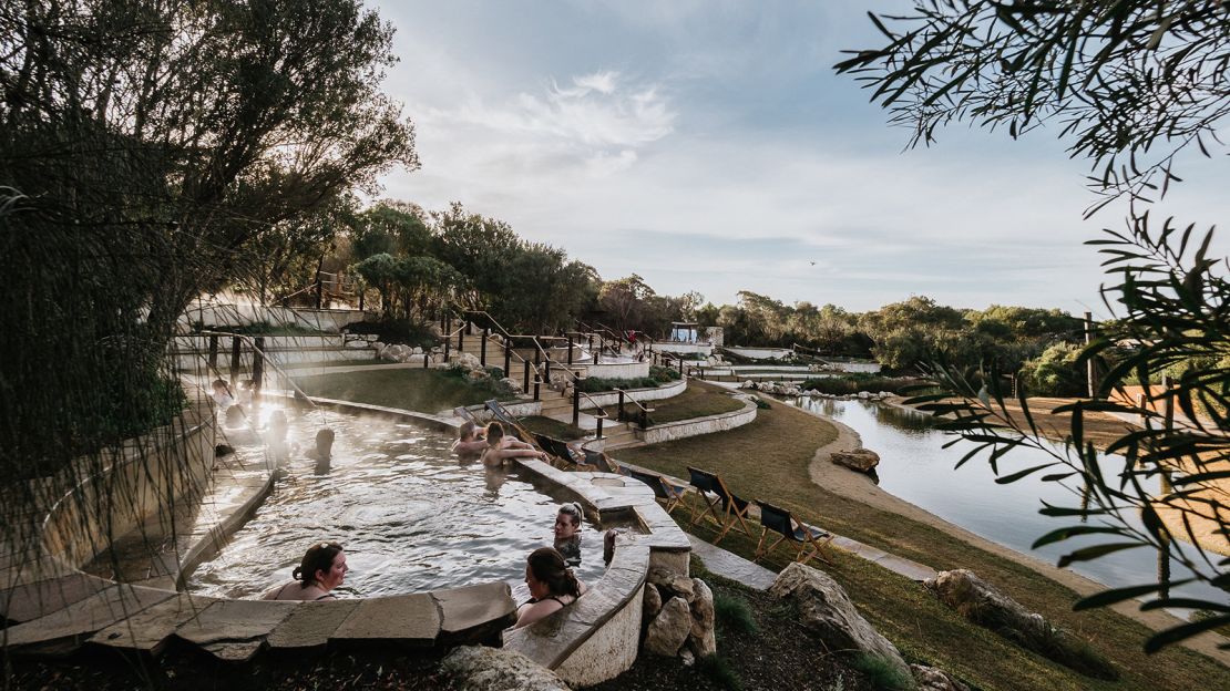 The new lakeside amphitheater at Peninsula Hot Springs lets visitors soak in hot baths while watching music performances.