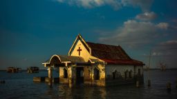 BULACAN, PHILIPPINES - NOVEMBER 27:  Sea water engulfs the church of Pariahan village  and the road leading to it, on November 27, 2018 in Bulacan, north of Manila. Pariahan used to be a bustling small village known for its serene beauty and its flamboyant fiestas. When tropical cyclone Nesat hit the country in 2011, the village was submerged in sea water and remained as such years after. Now, the villagers of the once beautiful village of Pariahan is slowly being washed away by the sea with its inhabitants have to bear living without land. 

A recent climate study by the United Nations has warned that the world has 12 years to limit rising temperatures and an additional half-degree Celsius would eventually lead to floods, droughts, extreme heat, and rising ocean levels that will impact hundreds of millions of people. According to experts, local economies would eventually take a major toll as hotter temperatures threaten forests and coastlines while depleting fisheries and agriculture, eradicating the oceans coral, and fueling food shortages, while a UN report released in March this year projected that all commercial fishing in the Asia-Pacific region could cease within 30 years if no actions against climate change are implemented. (Photo by Jes Aznar/Getty Images)