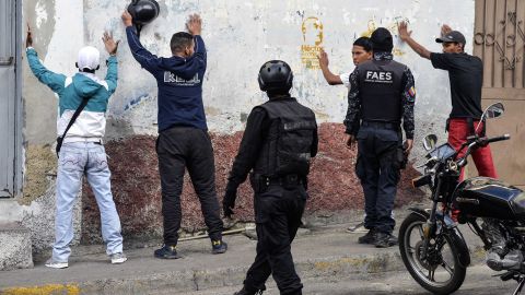 Special forces police detain a group of men during an operation in the Petare neighborhood of Caracas on Friday.