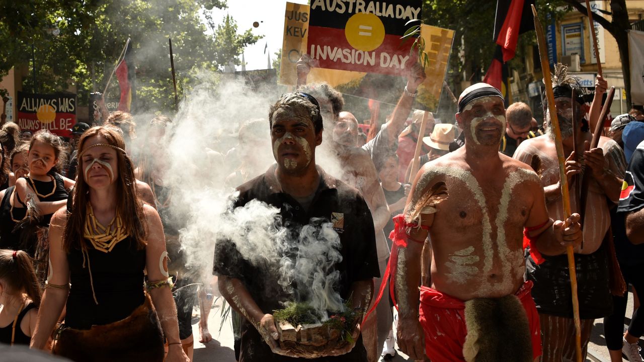 People take part in an "Invasion Day" rally on Australia Day in Melbourne on January 26, 2018.