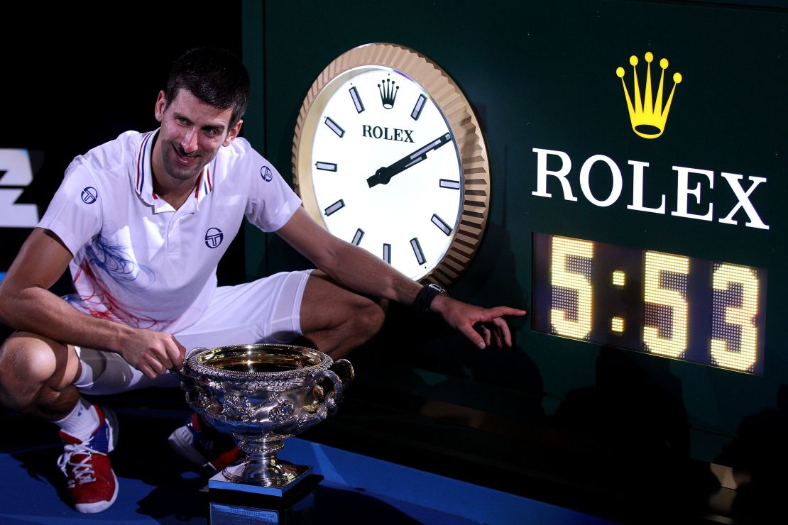 Novak Djokovic points to the clock after the epic 2012 Australian Open final. 