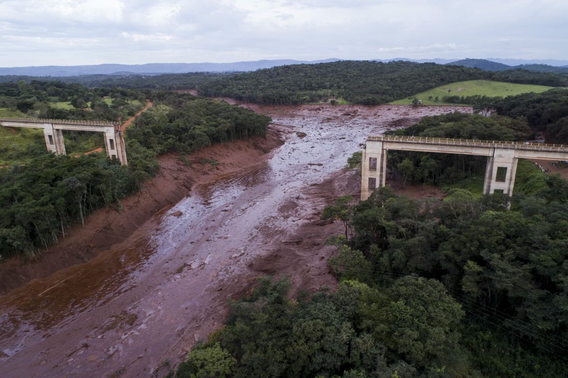 An aerial view shows a collapsed bridge after flooding from a breached dam Friday in southeast Brazil.