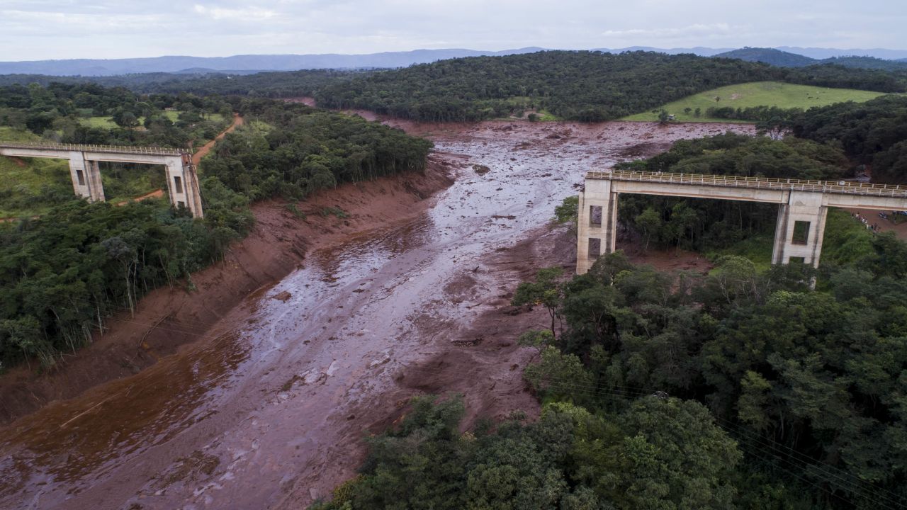 An aerial view shows a collapsed bridge after flooding from a breached dam Friday in southeast Brazil.