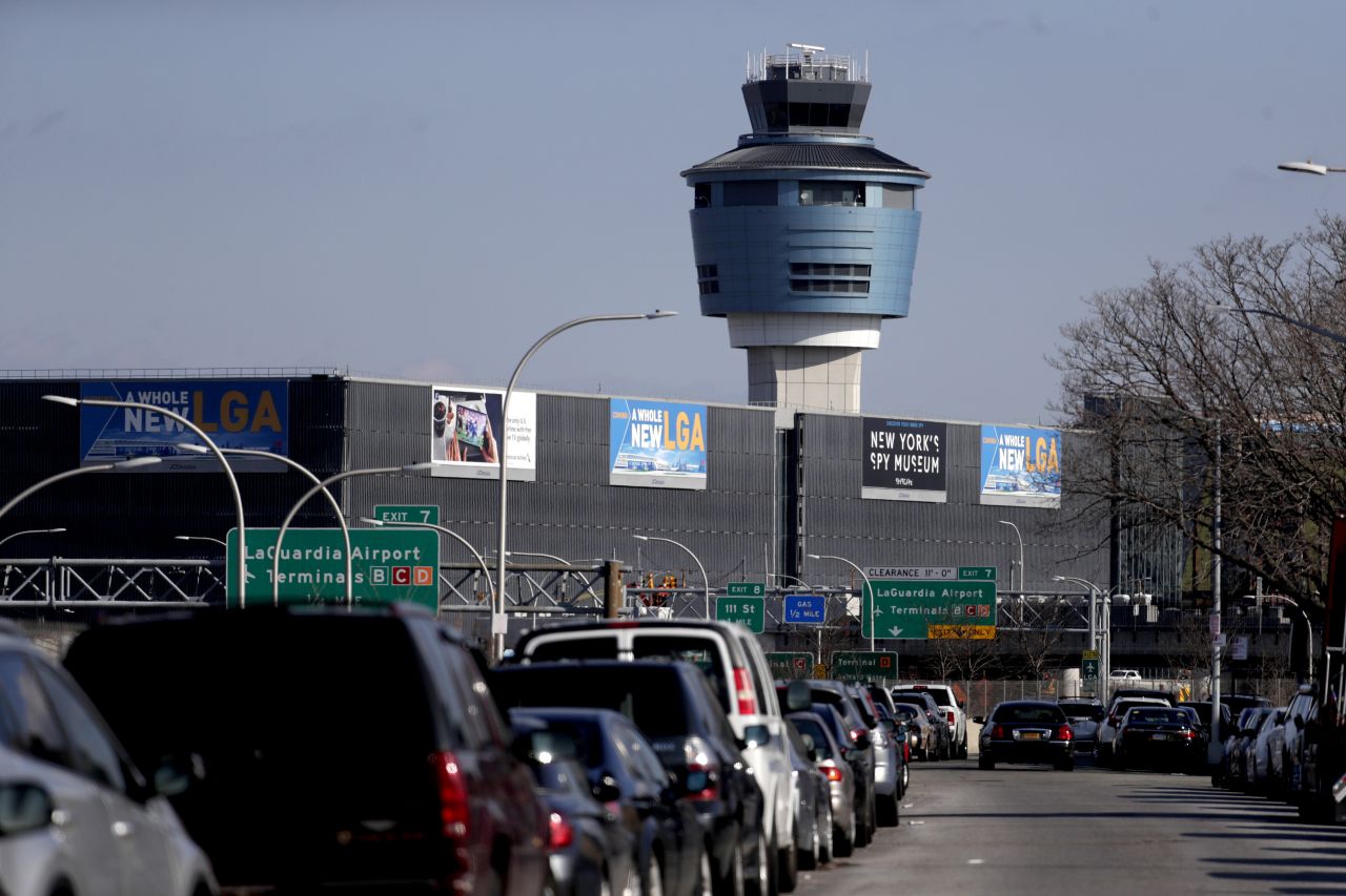 The air traffic control tower at New York's LaGuardia Airport on January 25. The Federal Aviation Administration reported delays in air travel because of a "slight increase in sick leave" at two East Coast air traffic control facilities.