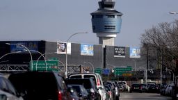 The air traffic control tower at LaGuardia Airport is seen, Friday, Jan. 25, 2019, in New York. The Federal Aviation Administration reported delays in air travel Friday because of a "slight increase in sick leave" at two East Coast air traffic control facilities.  (AP Photo/Julio Cortez)