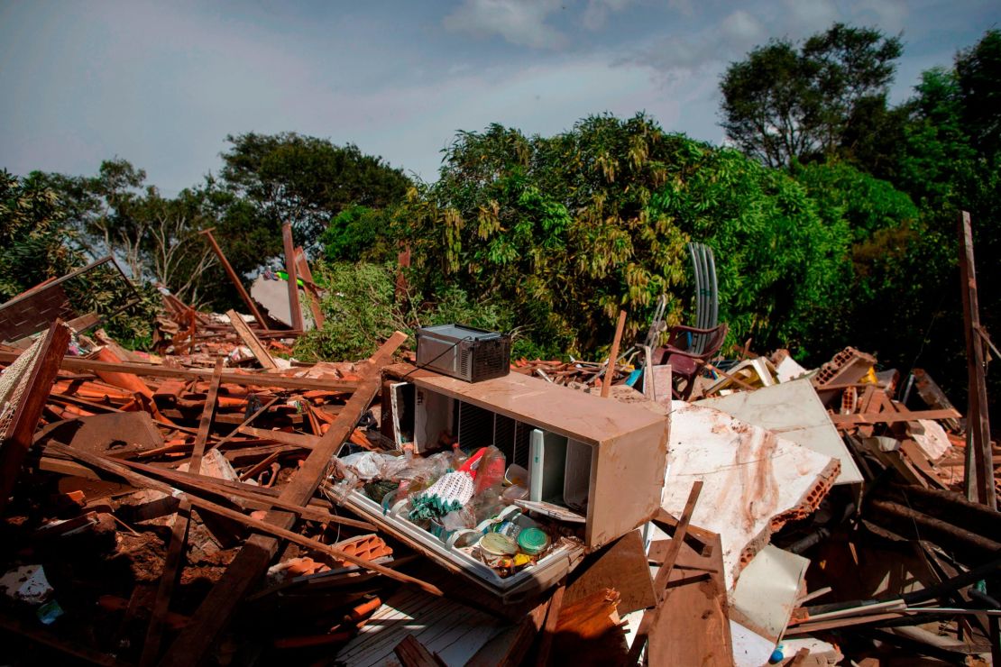 Debris is widespread Saturday in the Parque da Cachoeira community after the dam collapse.