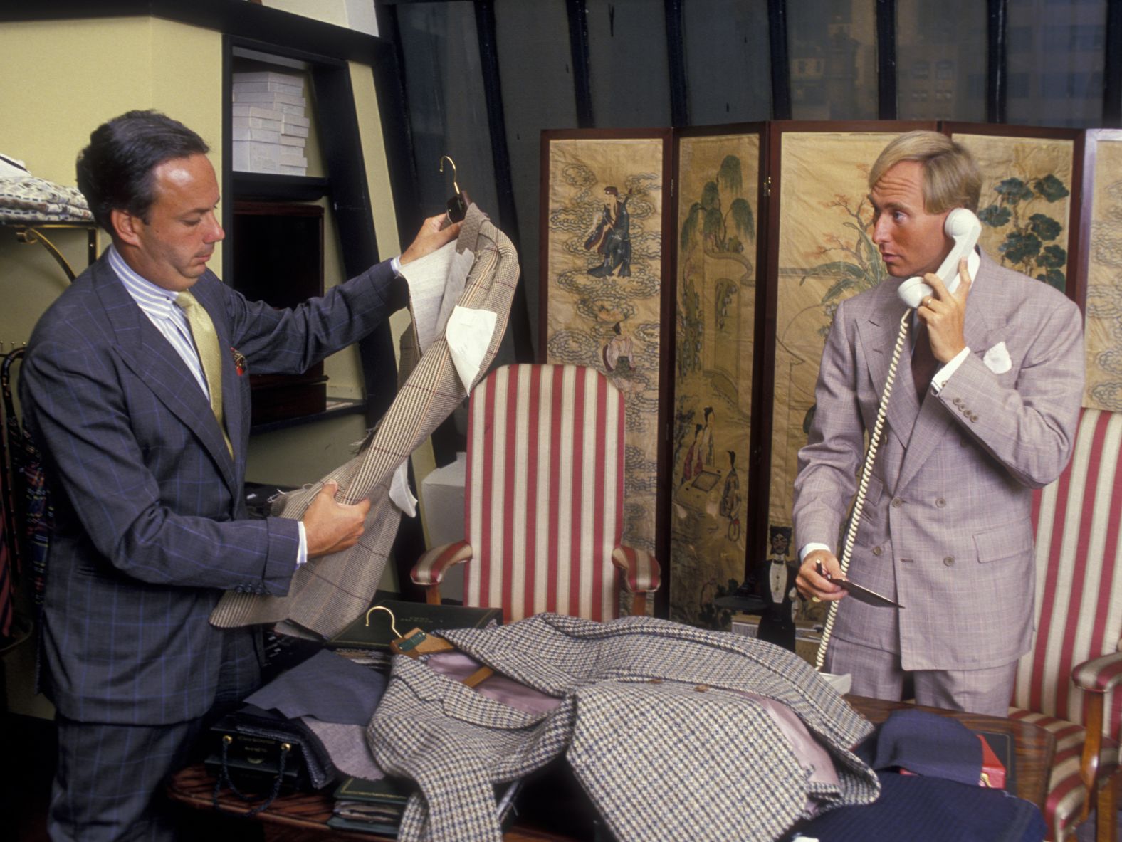 Stone and designer Alan Flusserare seen at the Alan Flusser Boutique in New York in August 1987.