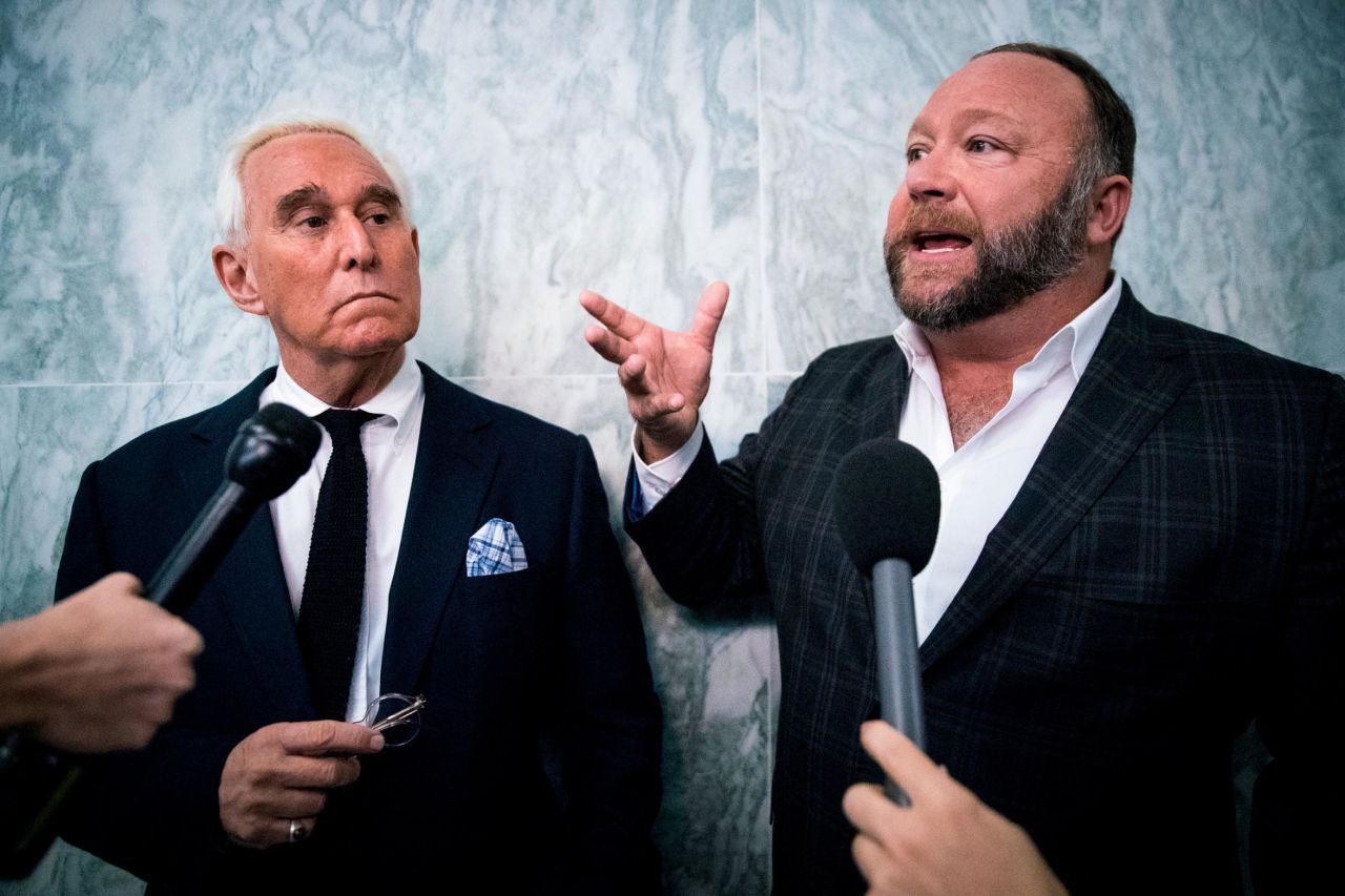 Stone and Alex Jones, the right-wing conspiracy theorist and talk-show host, speak to reporters outside the House Judiciary Committee in December 2018.
