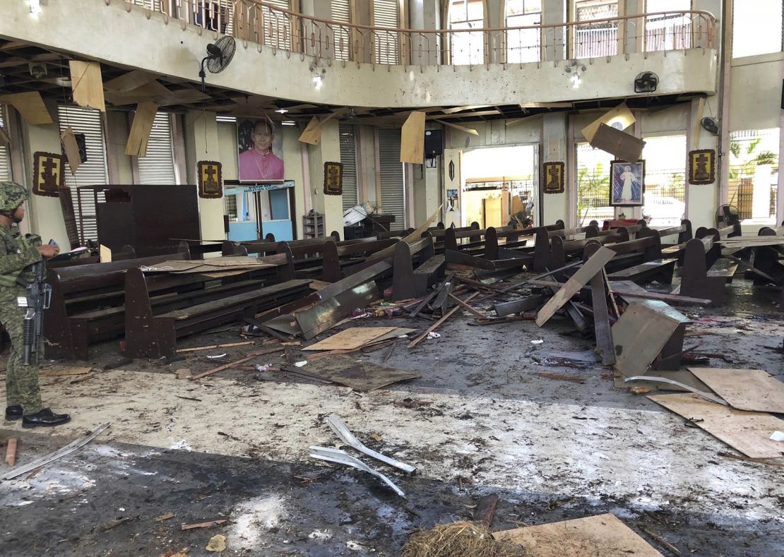 A soldier views the site inside a Roman Catholic cathedral in  southern Philippines after two bombs exploded Sunday. 