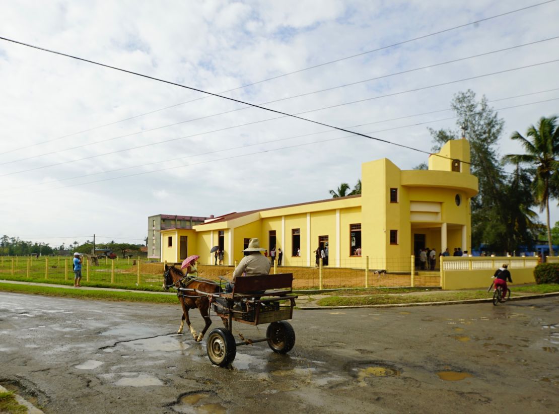 A horse and cart pass by the new church in Sandino, Cuba. The town in the early 1960's was notorious as a place where Cubans accused of helping anti-Castro rebels were sent to live in internal exile.
